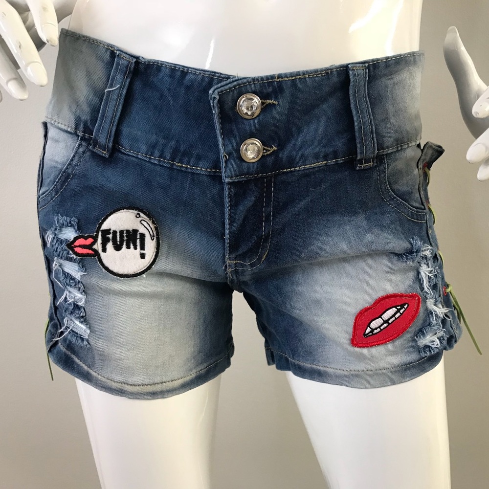 Blue jean shorts with patches